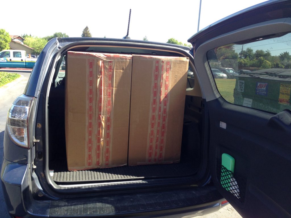 The 2012-14 Rav4 EVs have decent sized storage. Here I'm transporting two 3 foot tall boxes containing lasers that needed to remain upright. 