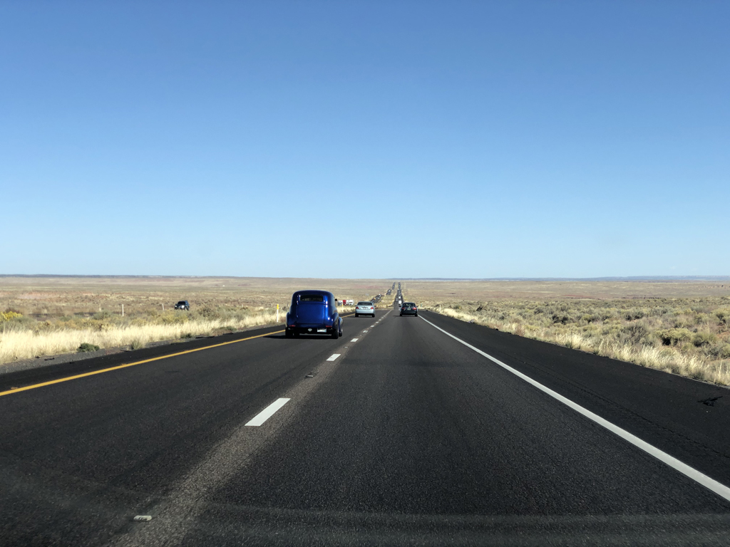 Picture showing very long straight highway in Arizona.